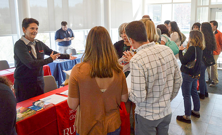 Students engaging with the Rutgers transfer table