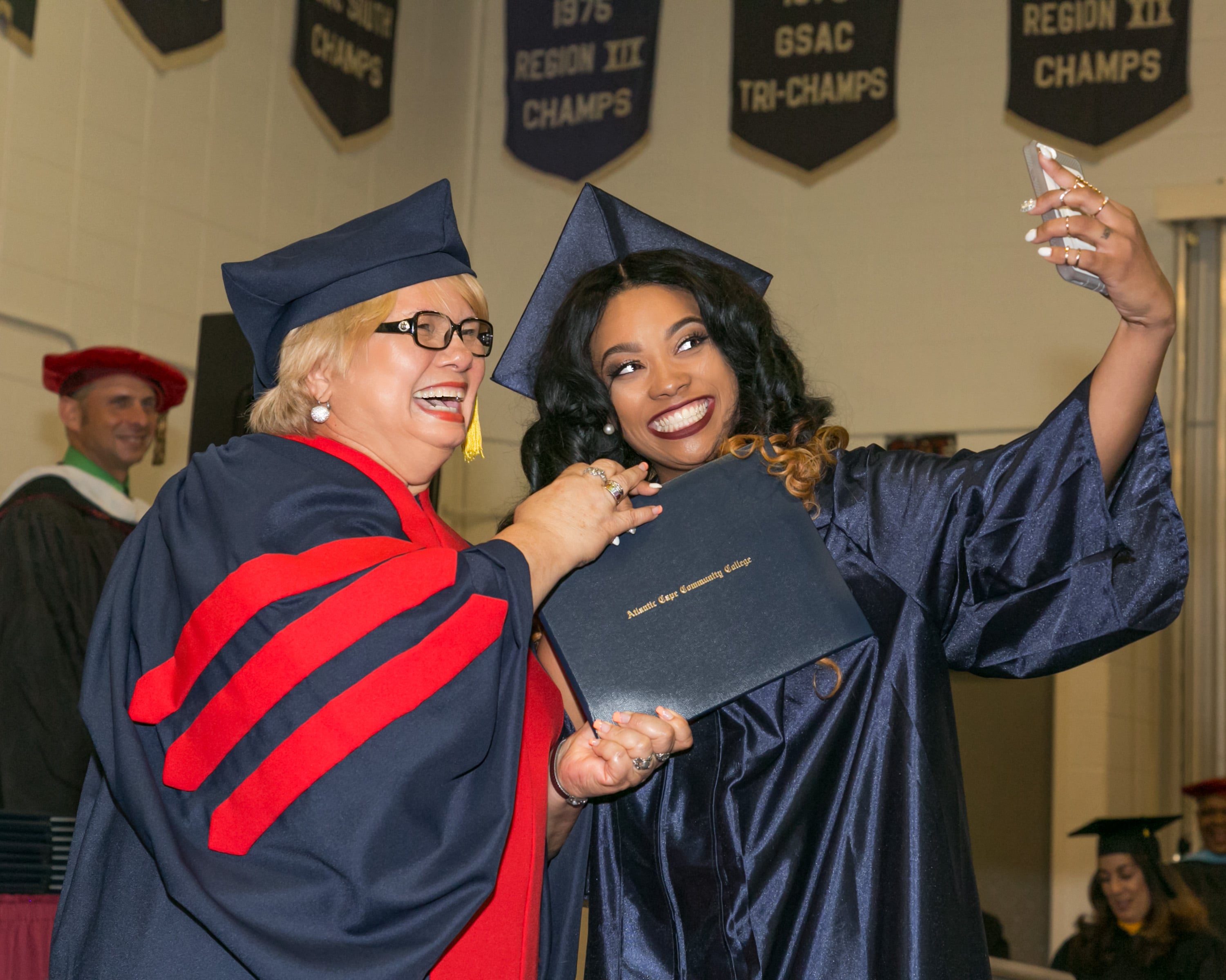 Graduate taking selfie with instructor