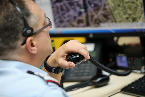 dispatcher holding a microphone