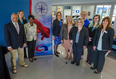 Representatives from the University of Phoenix, Atlantic Cape leadership and Atlantic Cape Nursing program members pose for a group photo following the agreement signing ceremony