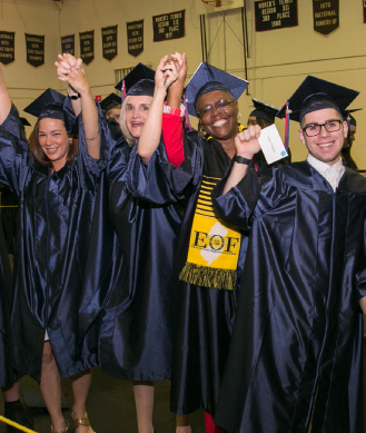 students celebrating at graduation