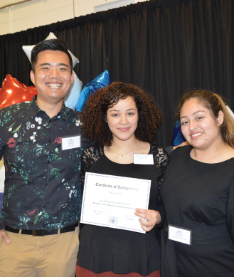 three students at scholarship recognition ceremony