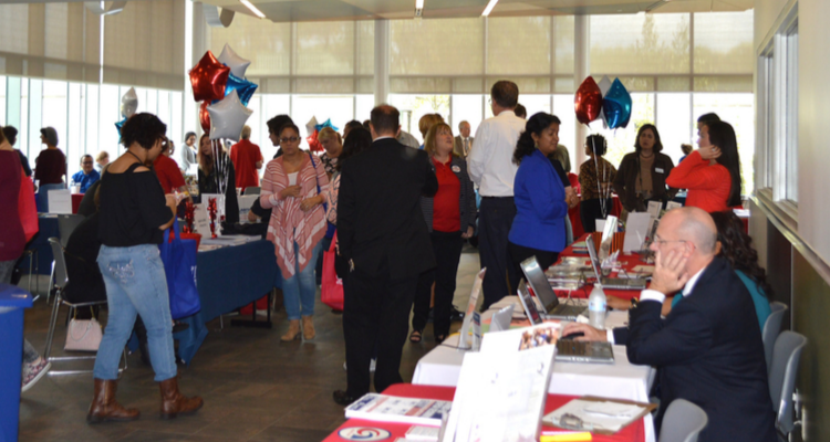 members of the public attend a resource fair available at all three campus locations