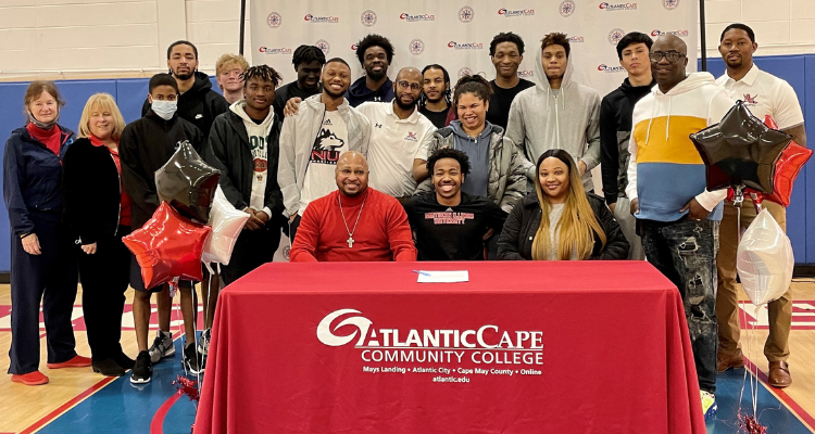 Atlantic Cape basketball player David Coit with his teammates, family members and college officials