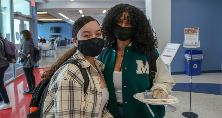 Atlantic Cape students Celimar Troche, 18, and Jenniffer Ozoria, 20, both of Pleasantville, stop by the Welcome Back table for a snack on the first day of Spring 2022 semester Jan. 24.